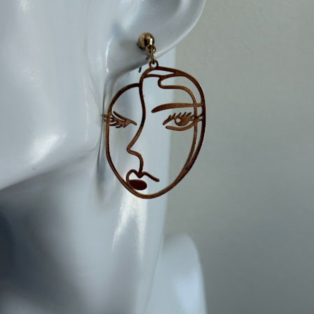 Whimsical Winking Gold Dangle Earrings